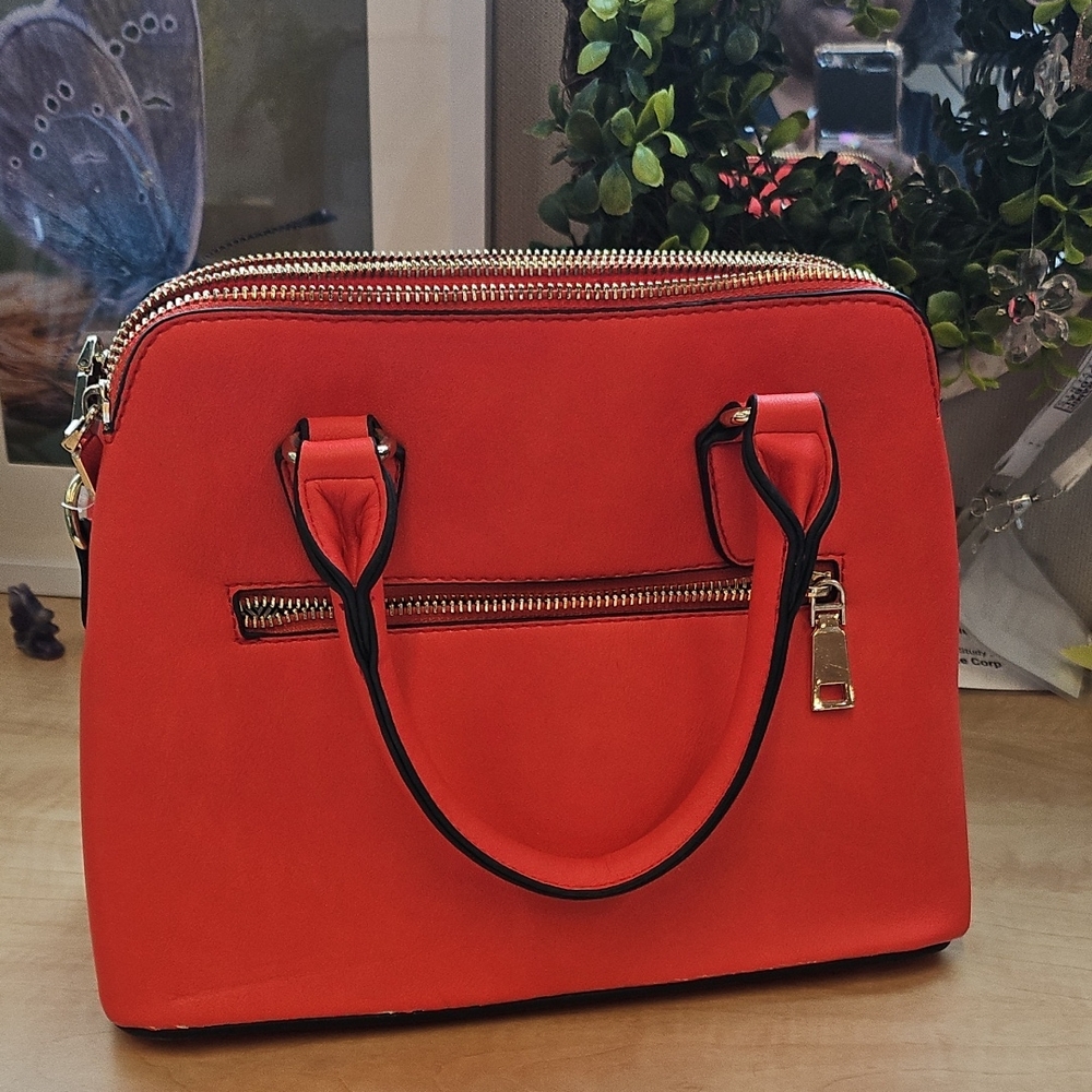 Chic Red Handbag with Gold Accents